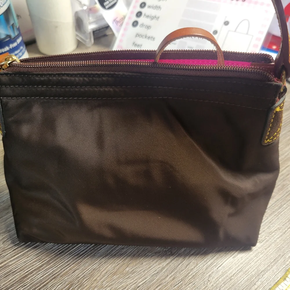 Dooney and Bourke Brown nylon Hand bag‎